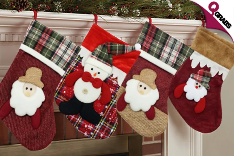 From QR34 Spread the Holiday Cheer with a Pair of Christmas Themed Gift Stockings - Choose from Santa & Snowman Designs! (Up to QR138 Value)